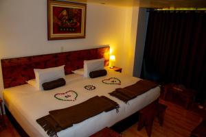 Voodi või voodid majutusasutuse Hotel Tara Machupicchu toas