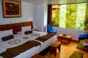 Voodi või voodid majutusasutuse Hotel Tara Machupicchu toas