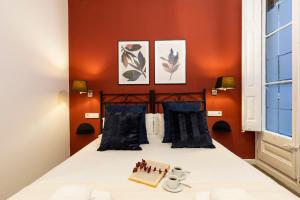 Posteľ alebo postele v izbe v ubytovaní Central Suites Barcelona