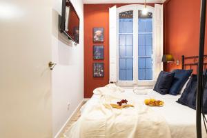 Posteľ alebo postele v izbe v ubytovaní Central Suites Barcelona