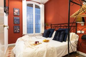 Posteľ alebo postele v izbe v ubytovaní Central Suites Barcelona
