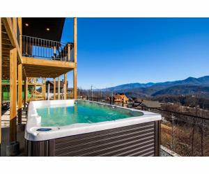a hot tub on the balcony of a house at Sky Ridge Mountain View Wheelchair Accessible and Swim Spa in Gatlinburg