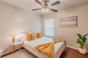 a bedroom with a bed with a ceiling fan at 3Bedroom 2Bathroom close to historic downtown fast wifi in McKinney +7 photos