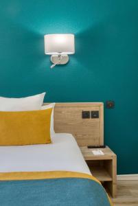 Katil atau katil-katil dalam bilik di Best Western Le Vauban