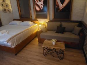 Ένα ή περισσότερα κρεβάτια σε δωμάτιο στο Optimist No.1