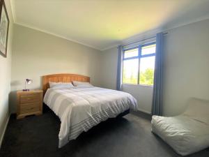 מיטה או מיטות בחדר ב-3 Oakview Close