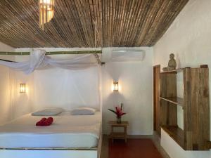 Ein Bett oder Betten in einem Zimmer der Unterkunft Finca Carpe Diem Ecolodge
