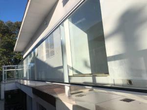 Ein Balkon oder eine Terrasse in der Unterkunft Suíte privativa próxima ao Sesc 1