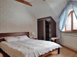 Postel nebo postele na pokoji v ubytování Zelena Sadyba