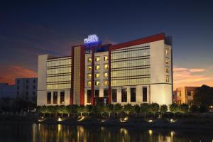 a hotel building with a sign on top of it at Le Lac Sarovar Portico- Ranchi in Rānchī