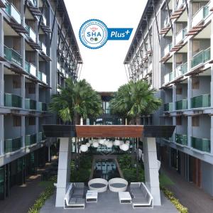 a view of the courtyard of a building at @T Boutique Hotel in Klong Wan