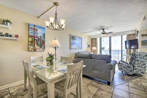 a living room with a table and a couch at Dreamy Beach Condo with Views and Amenity Access! in Myrtle Beach