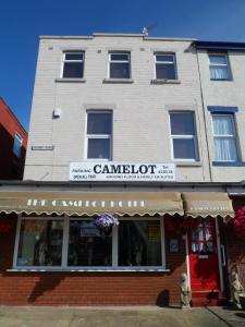 a building with a sign on the front of it at Camelot Hotel - Couples Only in Blackpool