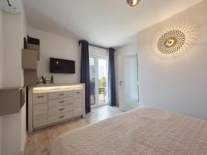 A bed or beds in a room at New apartment ViVaNo V I D with amazing view