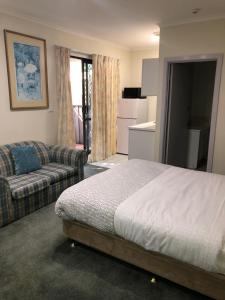 Postel nebo postele na pokoji v ubytování Evancourt Motel Malvern East