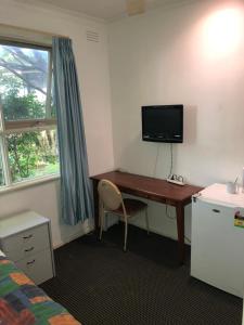 TV a/nebo společenská místnost v ubytování Evancourt Motel Malvern East