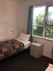 Postel nebo postele na pokoji v ubytování Evancourt Motel Malvern East