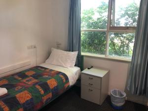 Postel nebo postele na pokoji v ubytování Evancourt Motel Malvern East