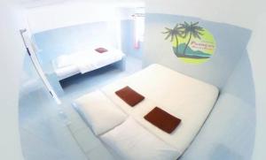 Postel nebo postele na pokoji v ubytování Phangan Mantra Inn