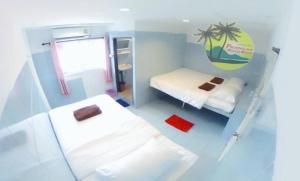 Postel nebo postele na pokoji v ubytování Phangan Mantra Inn