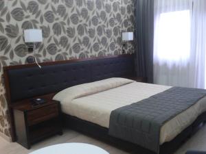 Postel nebo postele na pokoji v ubytování Hotel San Giorgio