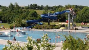 a group of people in a pool at a water park at Ferienwohnung-Am-Markt in Harzgerode
