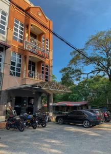 a hotel with motorcycles parked in front of it at KB MYPLACE in Kota Bharu