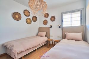 A bed or beds in a room at weforyou Med One Exclusive Sea Views 3 Bedrooms Apartament A 3A