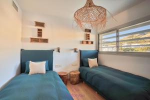 A bed or beds in a room at weforyou Med One Exclusive Sea Views 3 Bedrooms Apartament A 3A