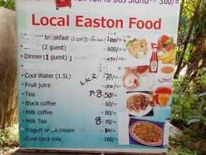 una señal para un restaurante local con comida. en Lotus Inn Tourist Resort, en Dambulla