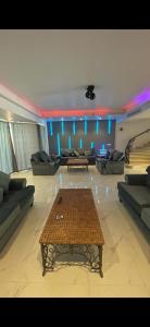 a large living room with couches and a table at فيلا بمسبح خاص درة العروس in Durat  Alarous