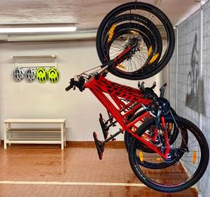a bike is upside down in a room at Hotel Brescia & Apartments in Boario Terme