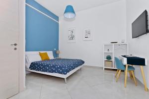 Giường trong phòng chung tại Blunotte Torino - Piazza Castello