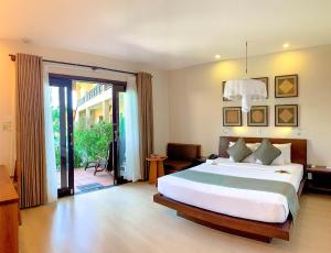 Giường trong phòng chung tại Bamboo Village Beach Resort & Spa