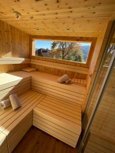 an inside view of a sauna with a window at Hotel Die Metzgerstubn in Sankt Michael im Lungau