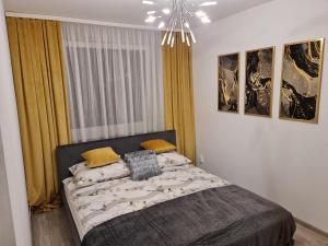 Posteľ alebo postele v izbe v ubytovaní Apartament Nova przy S3