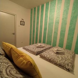 Postel nebo postele na pokoji v ubytování Daniris apartman