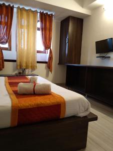 Postel nebo postele na pokoji v ubytování Hotel Yellow Stone