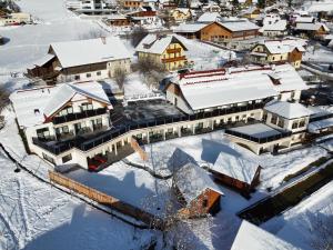 an aerial view of a town with snow covered buildings at Hotel Die Metzgerstubn in Sankt Michael im Lungau