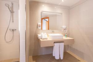 a bathroom with a sink and a shower at Apartamentos Vista Sur in Playa de las Americas