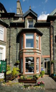 a brick house with a window on the side of it at Abacourt House in Keswick