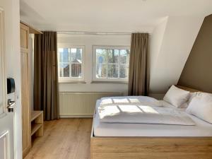 Postel nebo postele na pokoji v ubytování Waldhotel Eichenhof