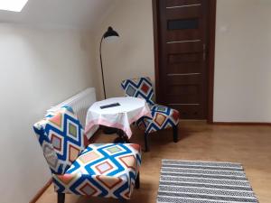 Noclegi Pod Dębem, Pulandia Brzózki客房内的一张或多张床位