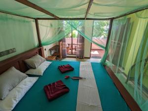 Postel nebo postele na pokoji v ubytování Namal Stay