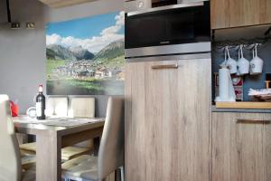 A kitchen or kitchenette at Baita del Sole Appartamento 3 Még 27 kép