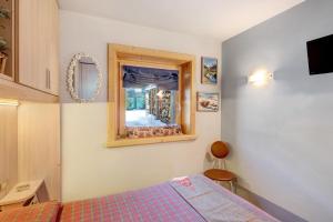 A bed or beds in a room at Baita del Sole Appartamento 3