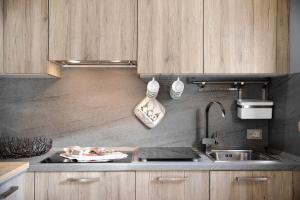 A kitchen or kitchenette at Baita del Sole Appartamento 3