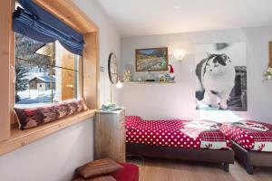 A bed or beds in a room at Baita del Sole Appartamento 3