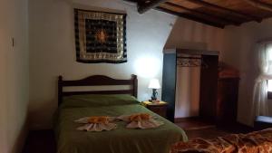 Giường trong phòng chung tại Cabañas La Polaca 2