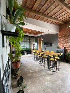 a dining room with a table and chairs at Dia 32 Guest House in Esperanza